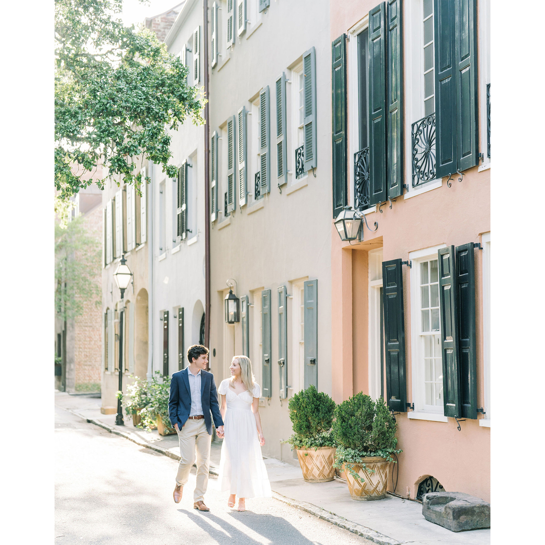 Bride and groom on a pastel historic Charleston street